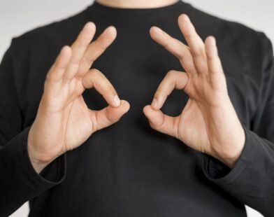 close-up-interpreter-teaching-sign-language